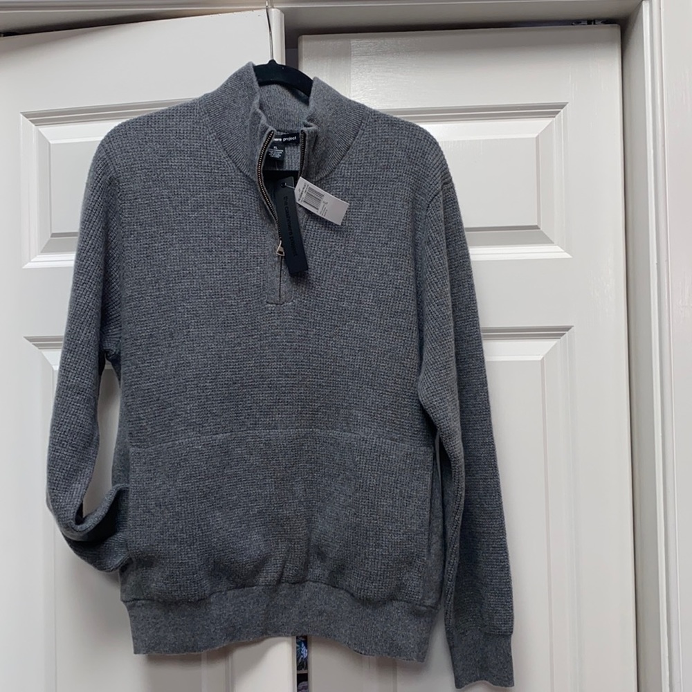 New Cashmere 1/4 zip front center pocket sweater.